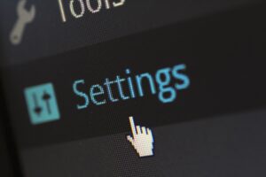 The WordPress admin dashboard, cursor hovering over 'Settings'